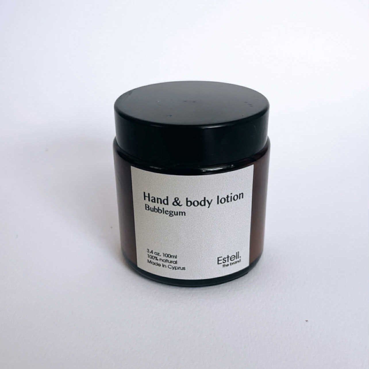 Hand and body lotion jar labeled 'Bubblegum' by Estelle on a white background